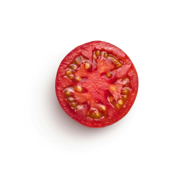 the small tomato has many small seeds on it