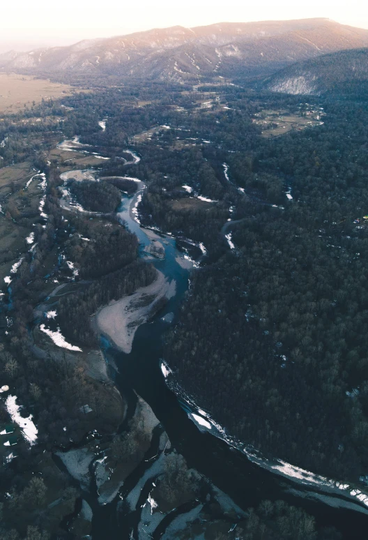 this is an aerial view of the river and land