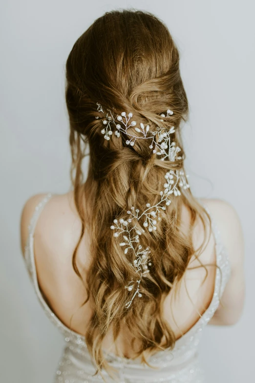 woman wearing elaborate hair accessories as she looks back