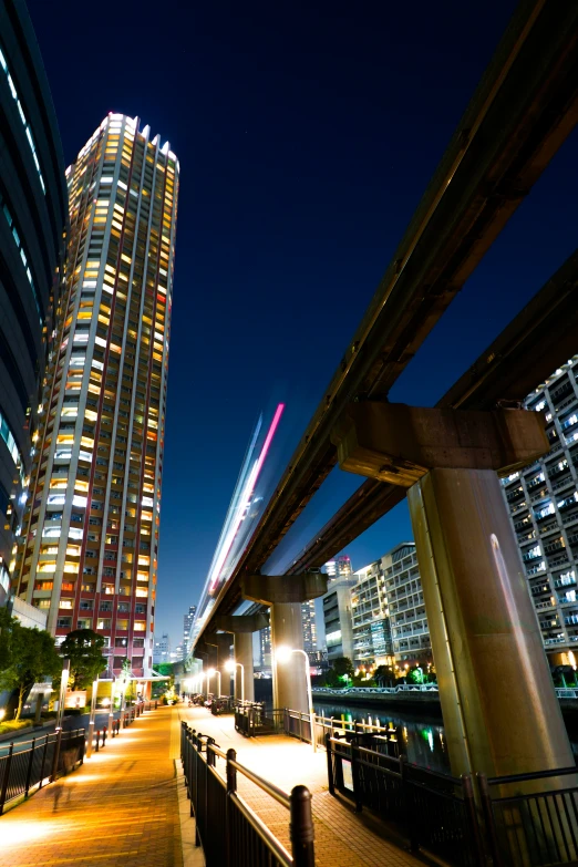 the skyline is lit up at night in the city