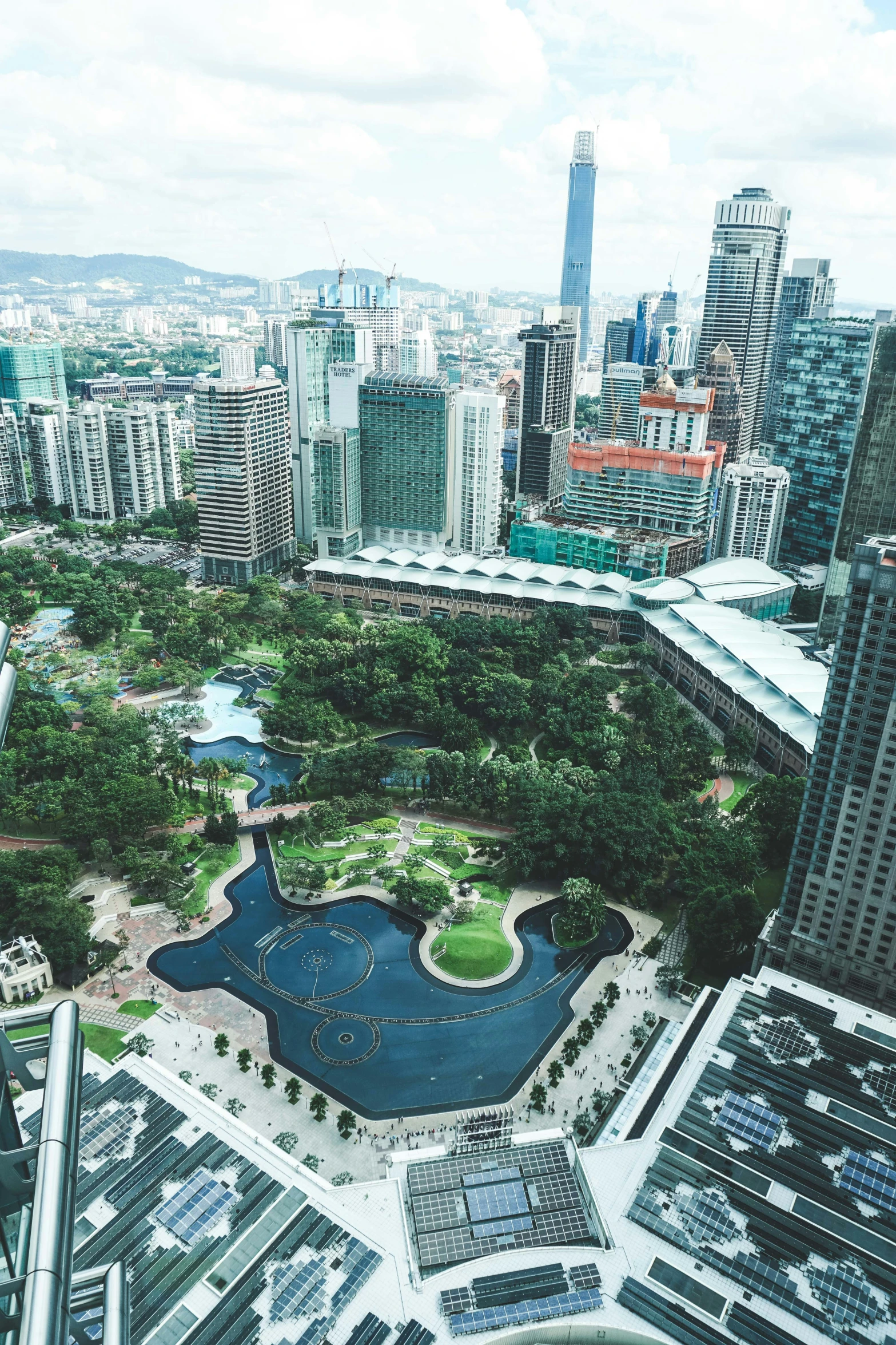 aerial view of an urban city including river, skyscrs and buildings