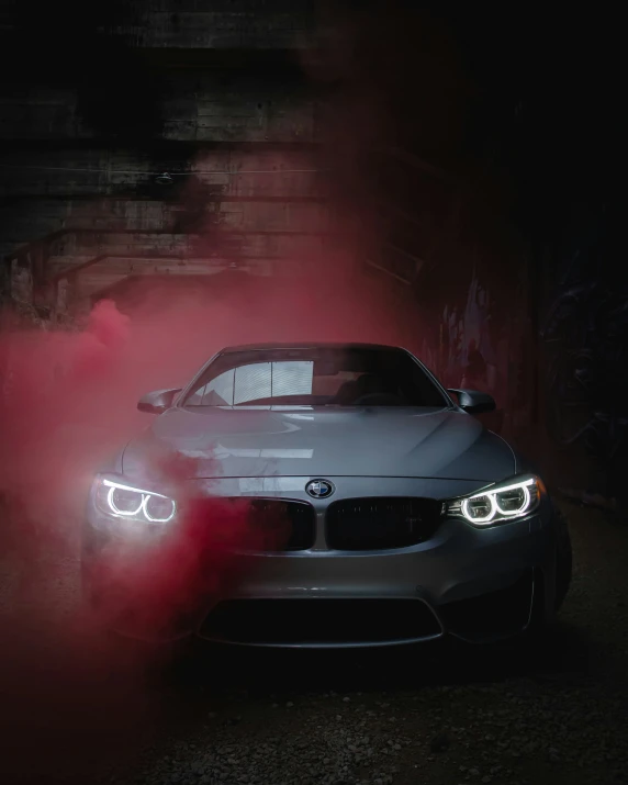 bmw car with red smoke coming out