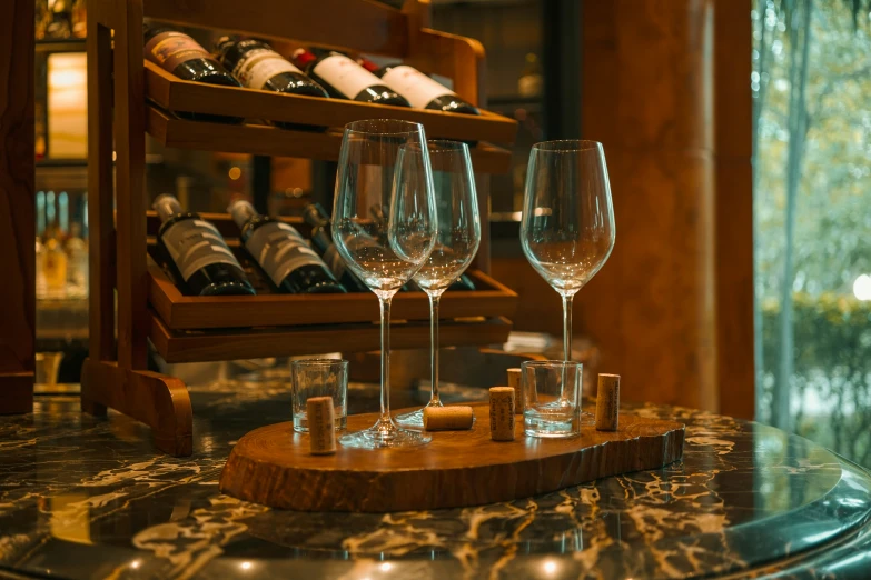 a bar has three wine glasses on it