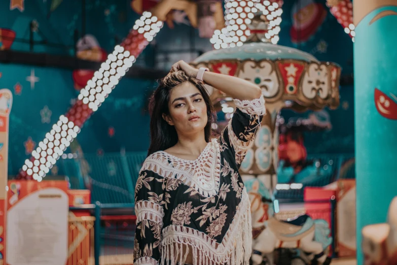 young asian woman posing at a carnival fair