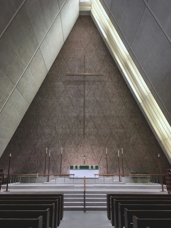 view of rows of benches and a large, vaulted ceiling