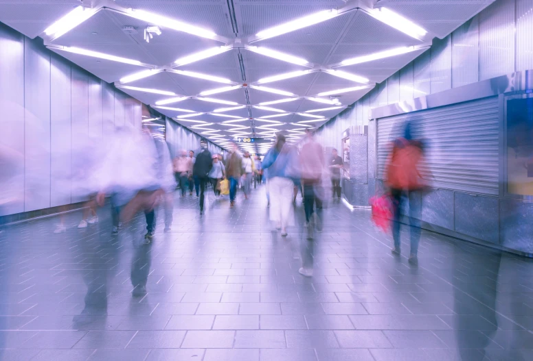 people walking down the floor in a building