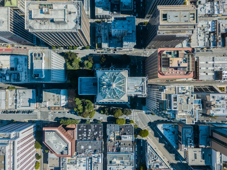 a cityscape with buildings and blue skies in the sky