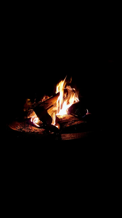 a fire pit at night, illuminated by bright sunlight