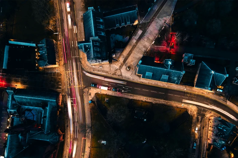 an overhead view of an intersection at night