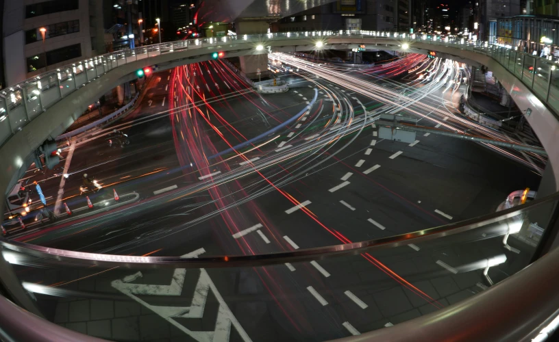 an interstate intersection at night is seen from above