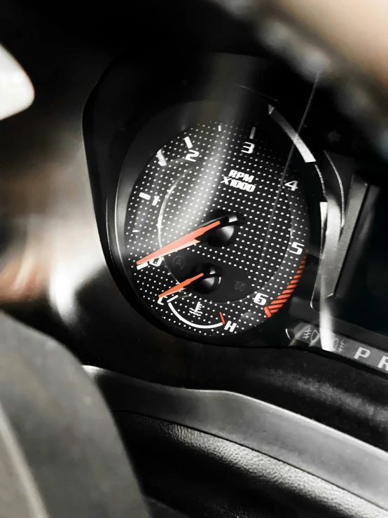 close up view of a meter on a car dashboard