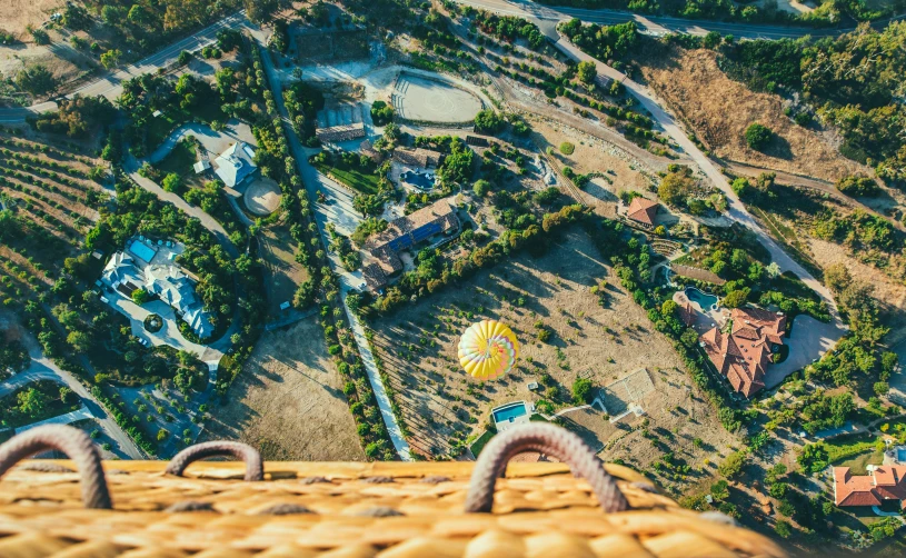 an aerial view of several picnic tables and chairs in a yard