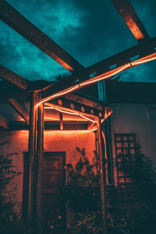 lights on a building in the evening, under a lit area