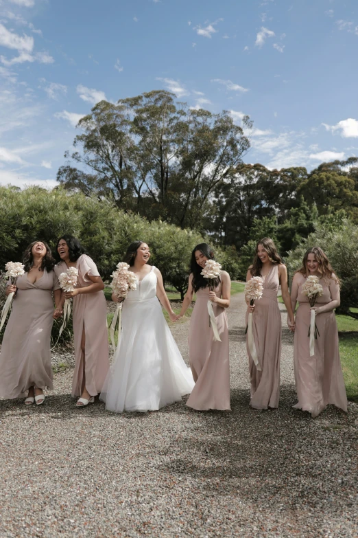 a bunch of women posing for the camera