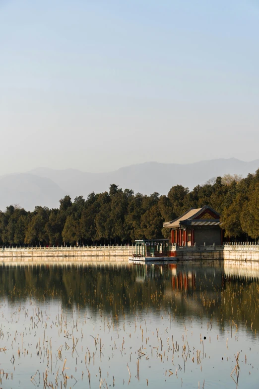 the small hut is located in front of the water