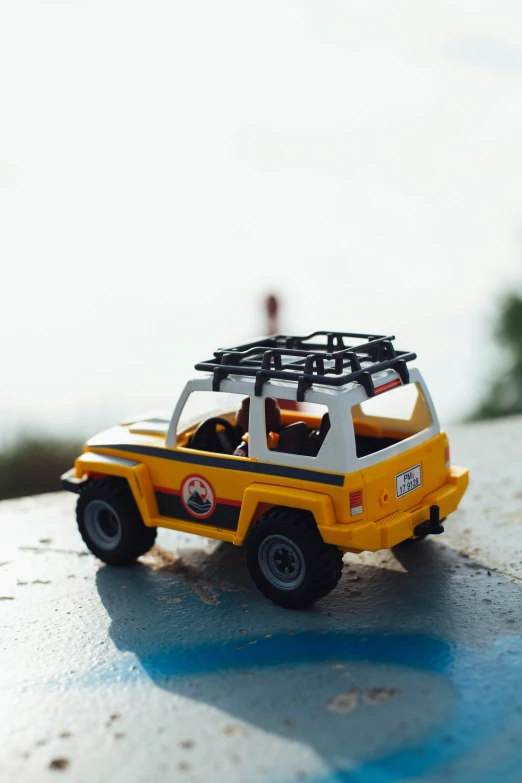 small toy suv parked on top of table