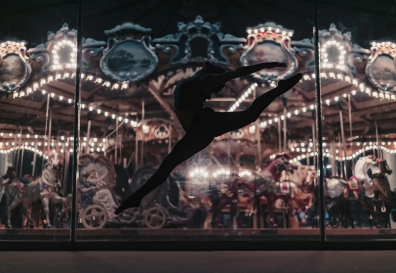 a person is doing tricks on the dance carousel