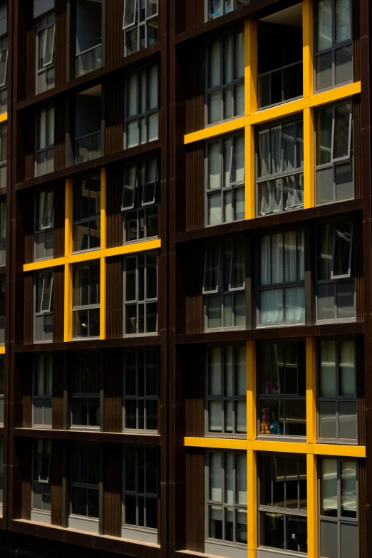 the bottom portion of a large multi - story building with lots of windows