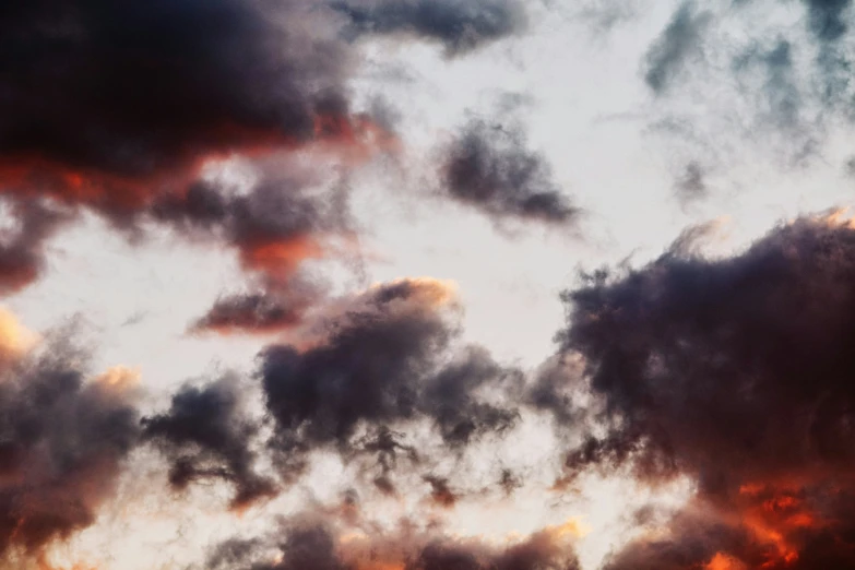 a po of the sky with clouds and some buildings