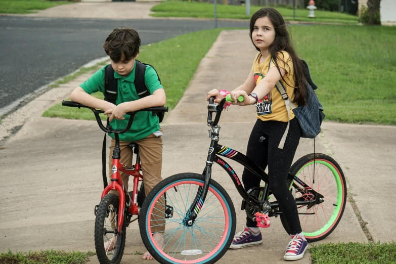 the two young s are on their bikes and ready to go for the race