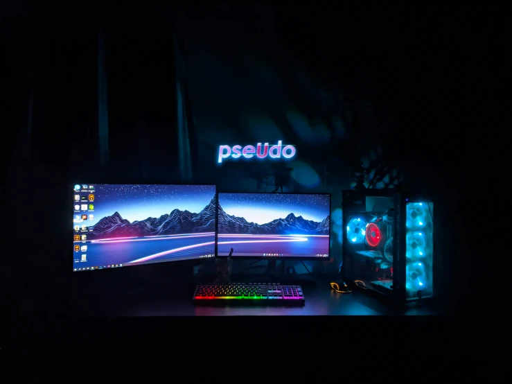 a computer desk with two monitors and an external keyboard