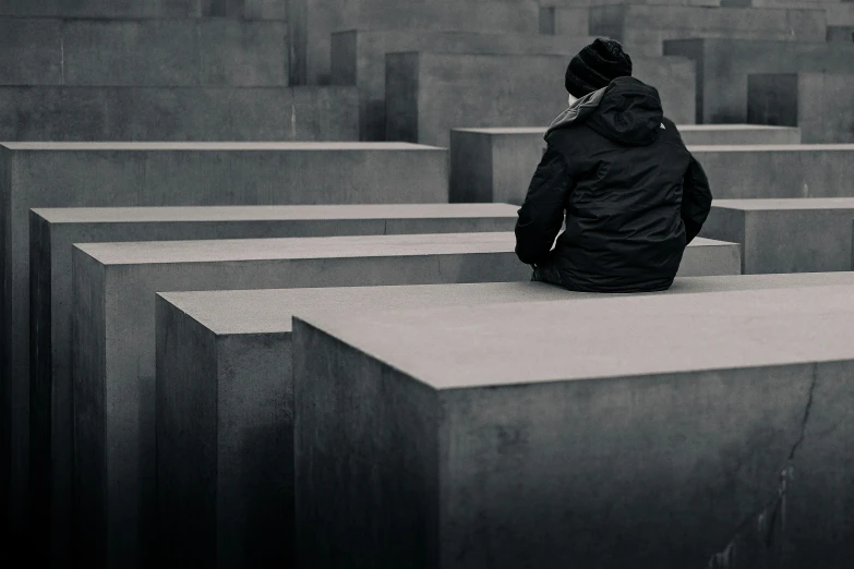 person looking out from the wall of rememnce