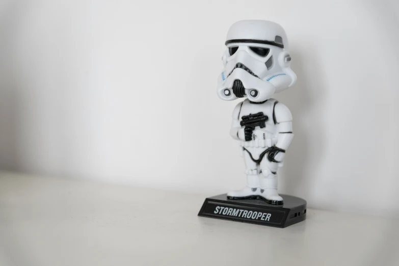 the small storm trooper is on display on the table