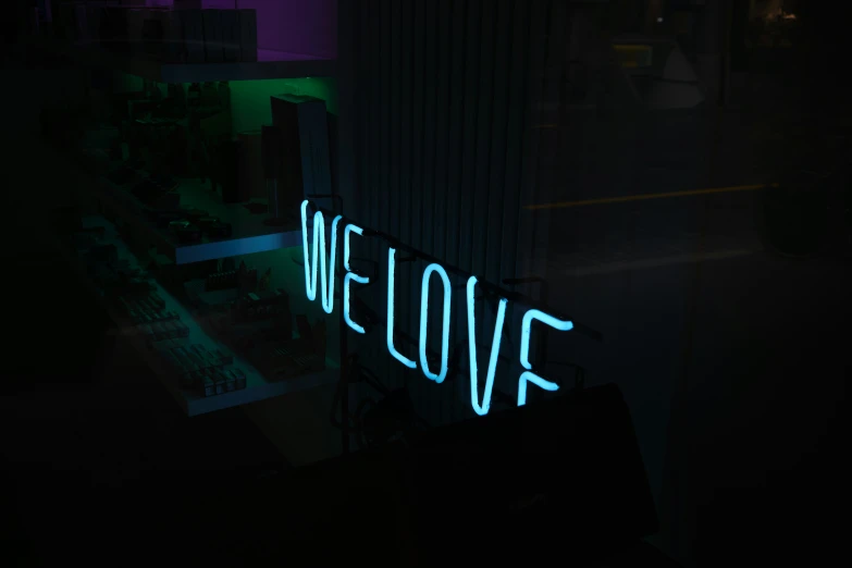 we love neon light up sign on a window