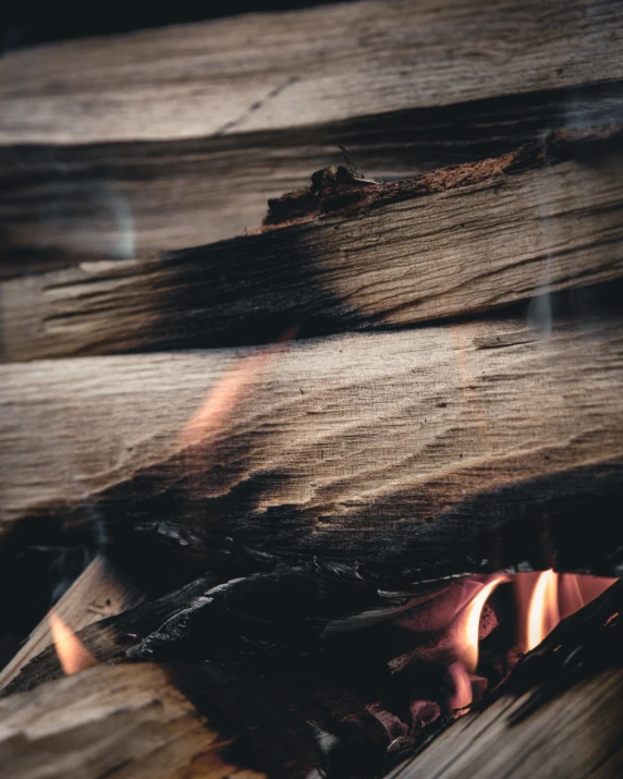 a close up view of a wood with flame