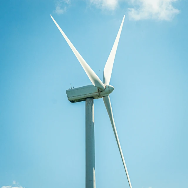 an image of a wind turbine and a boat