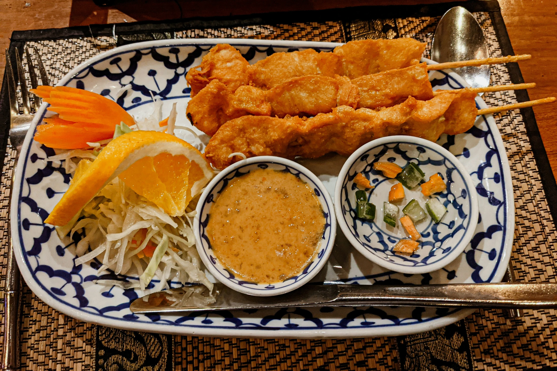 some very tasty looking food on a white and blue plate