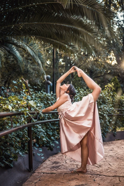 a woman wearing a dress dancing on the steps