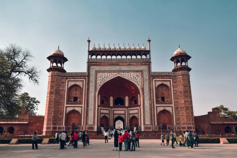 a very large red brick building with arches