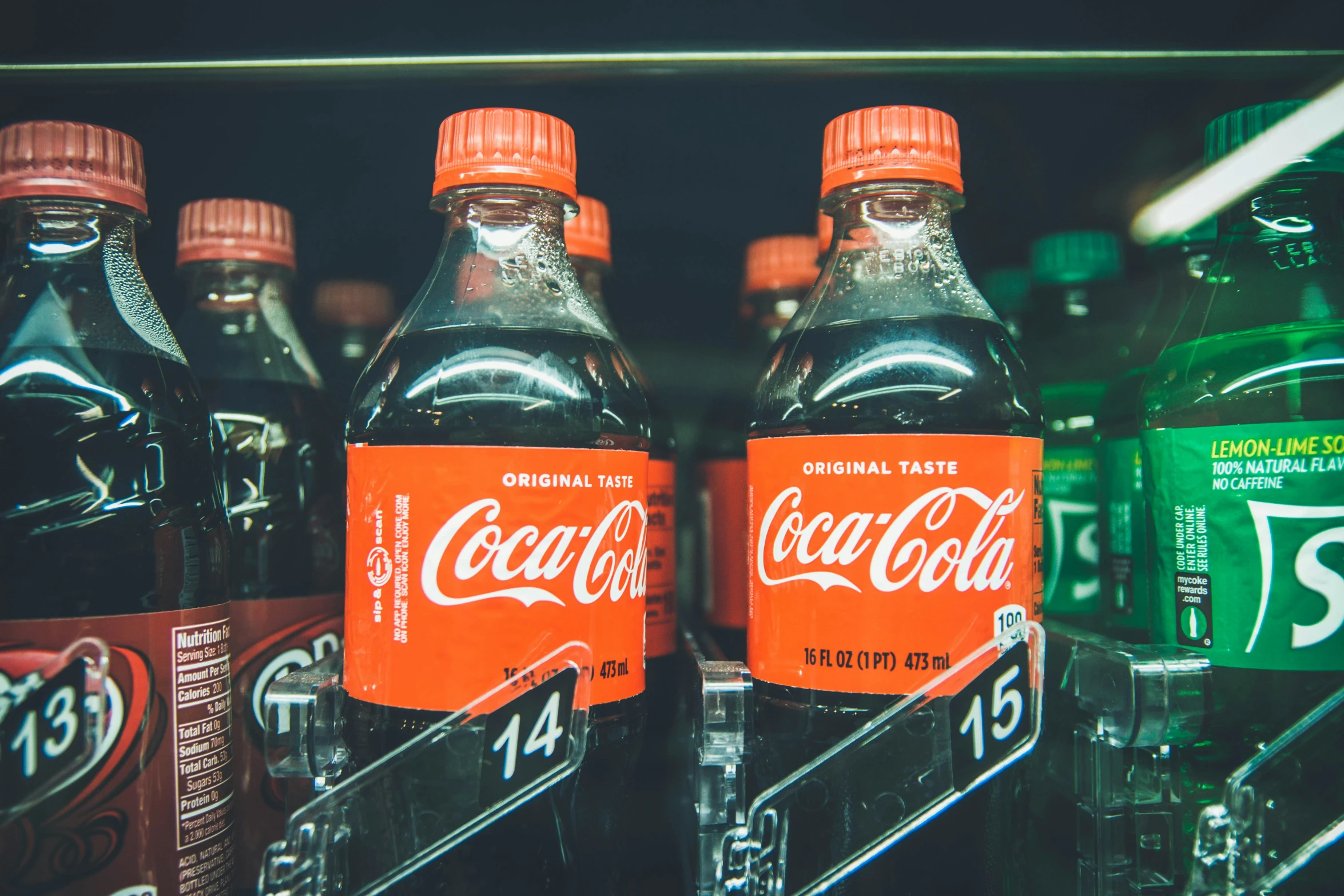 several bottled drinks with different flavor and colors