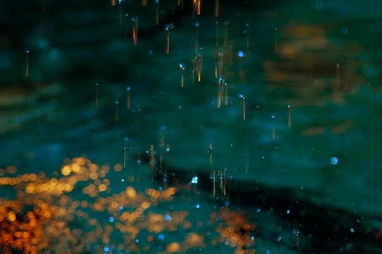 some water that is dripping from a umbrella