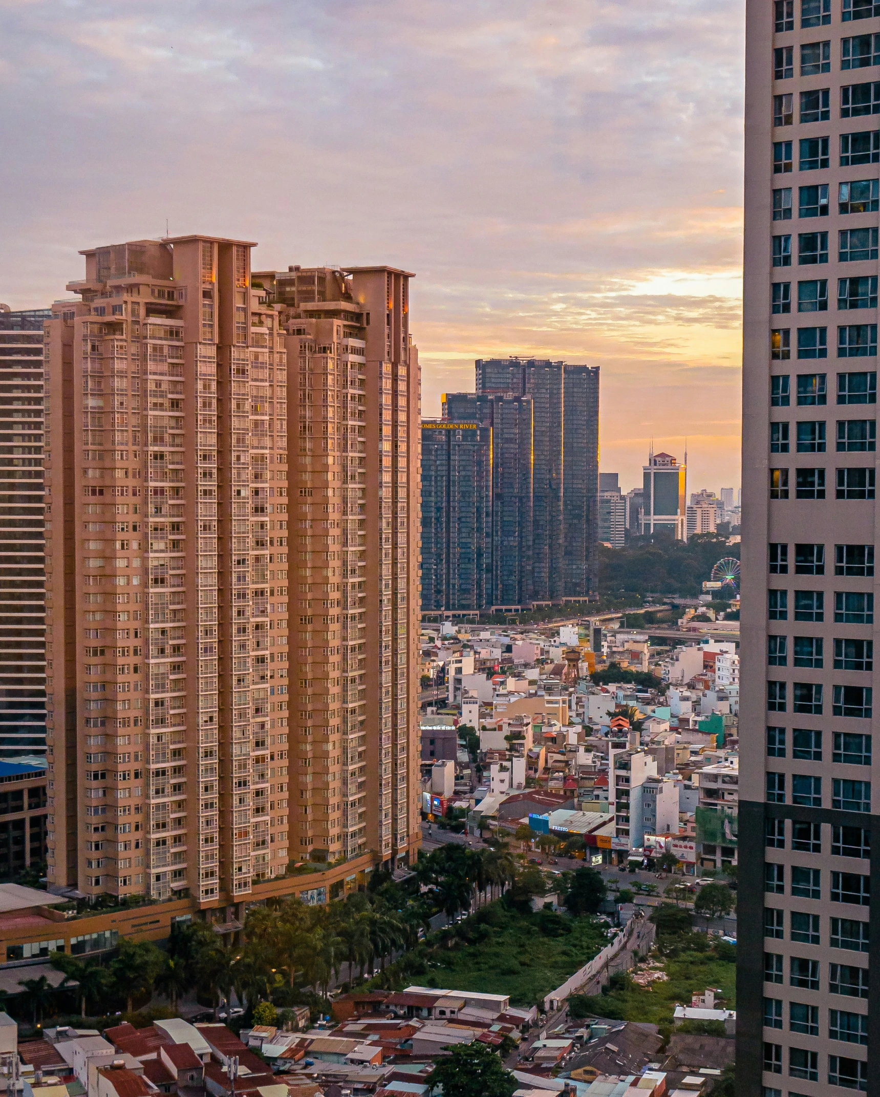 the city skylines are at dusk and are lit up