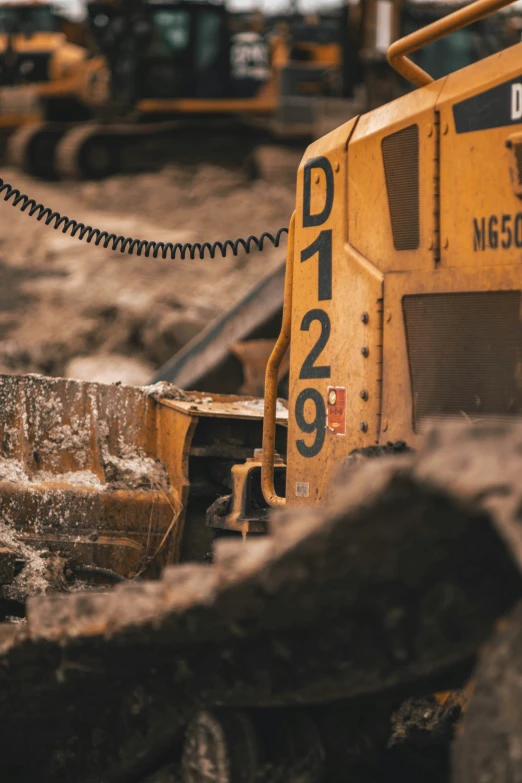 a number of excavators in a construction site