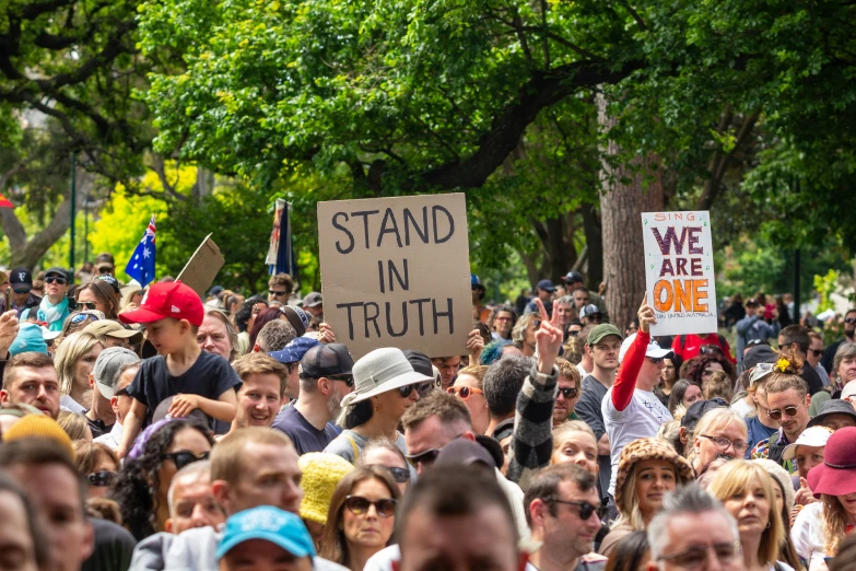 a huge crowd of people are gathered together in the streets