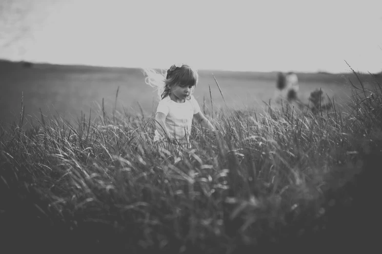  in white dress running through tall grass