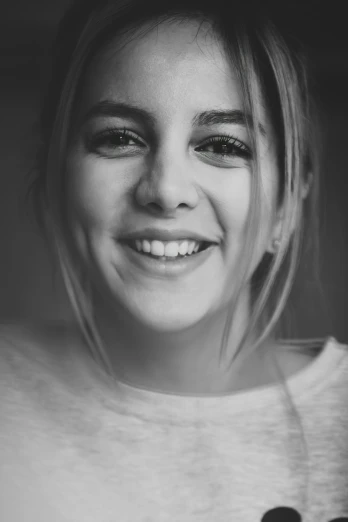black and white portrait of a little girl smiling