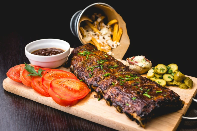 some food is laying out on a wood tray