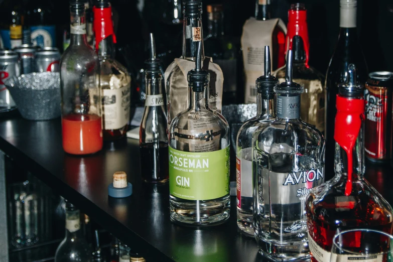 liquor bottles and bottles of various types are on the bar