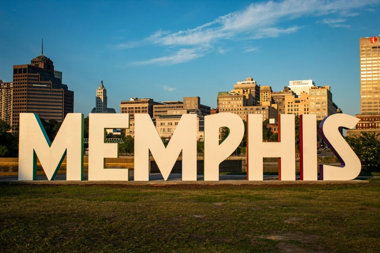 a city skyline with a giant sign that says memphs