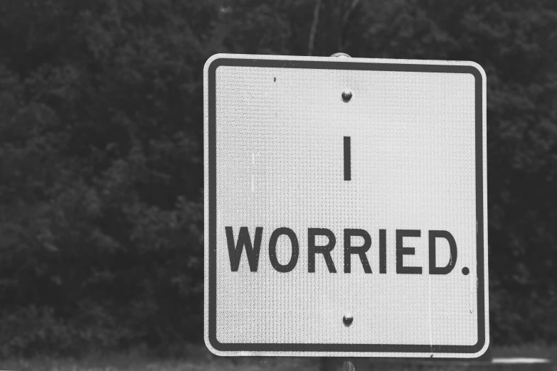 black and white pograph of a street sign saying i worried