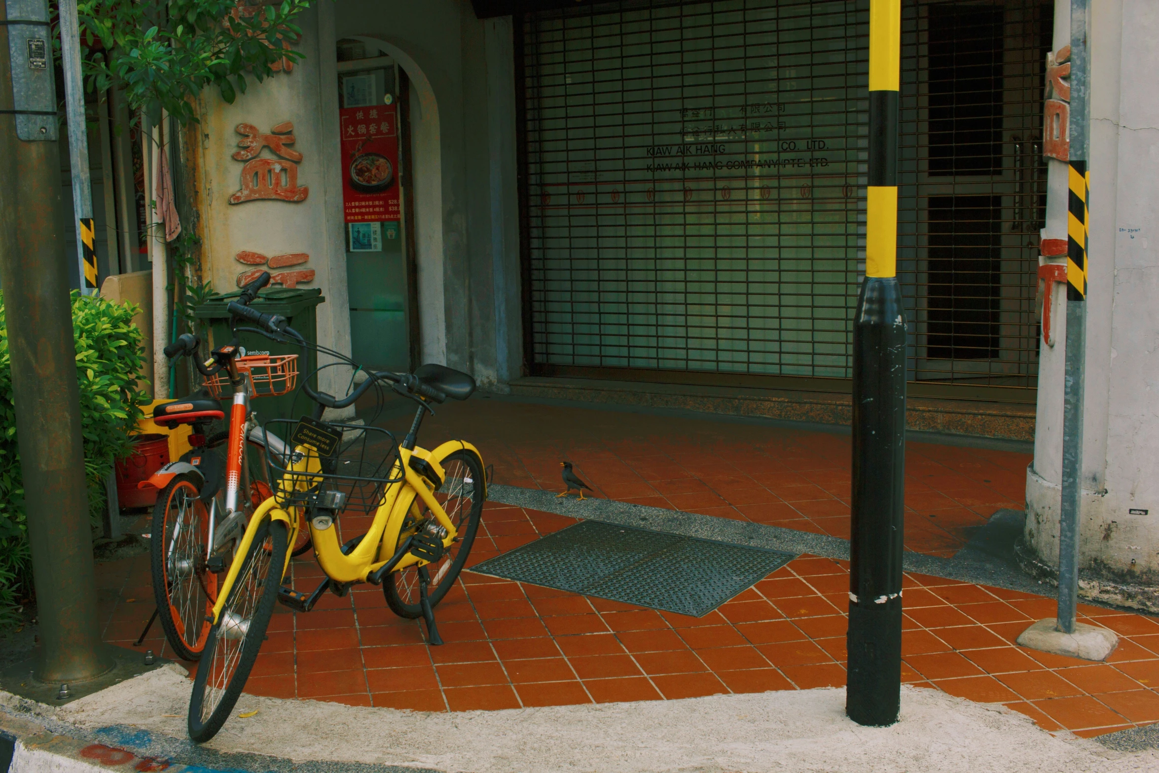 a bike parked next to a building and street lamp