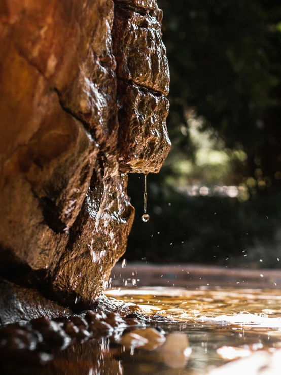 water flowing from a large water source into a pool