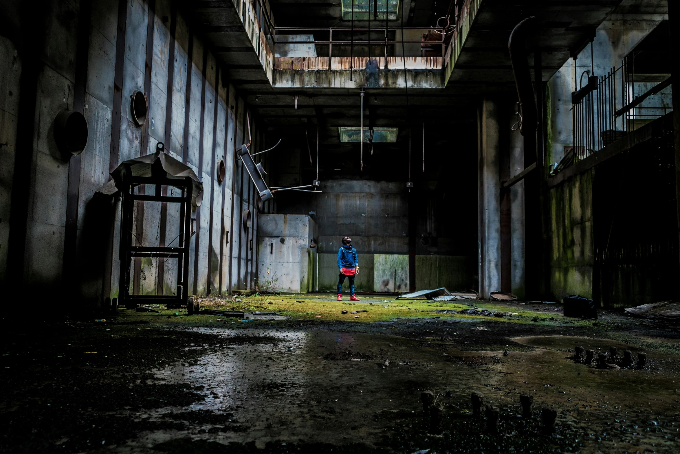 an empty hallway that is very dark and empty