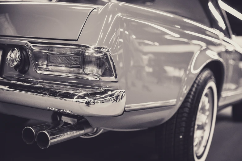 a black and white po of the front end of a parked car