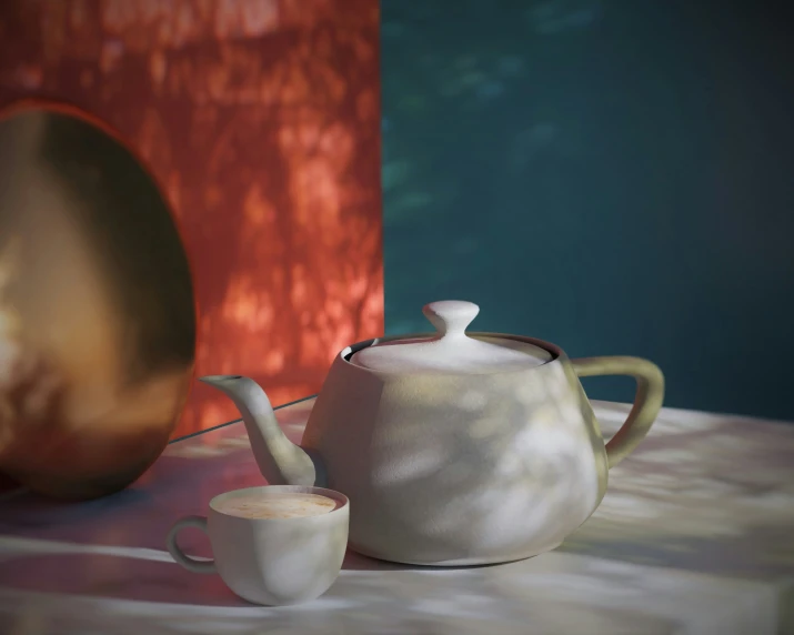 a white tea pot next to a coffee cup