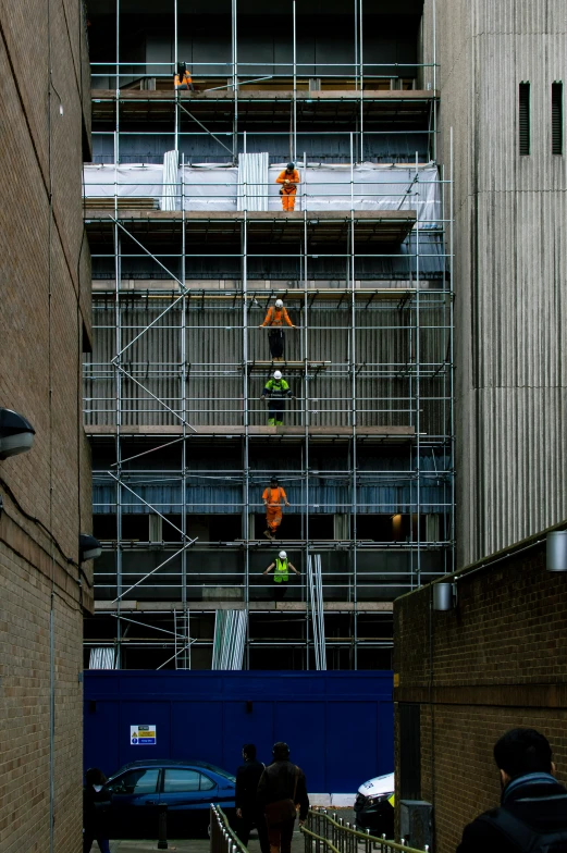 a large metal building under construction with scaffolding